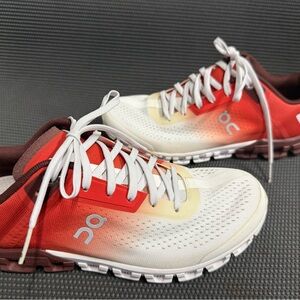 On Running White and Red Athletic Shoes